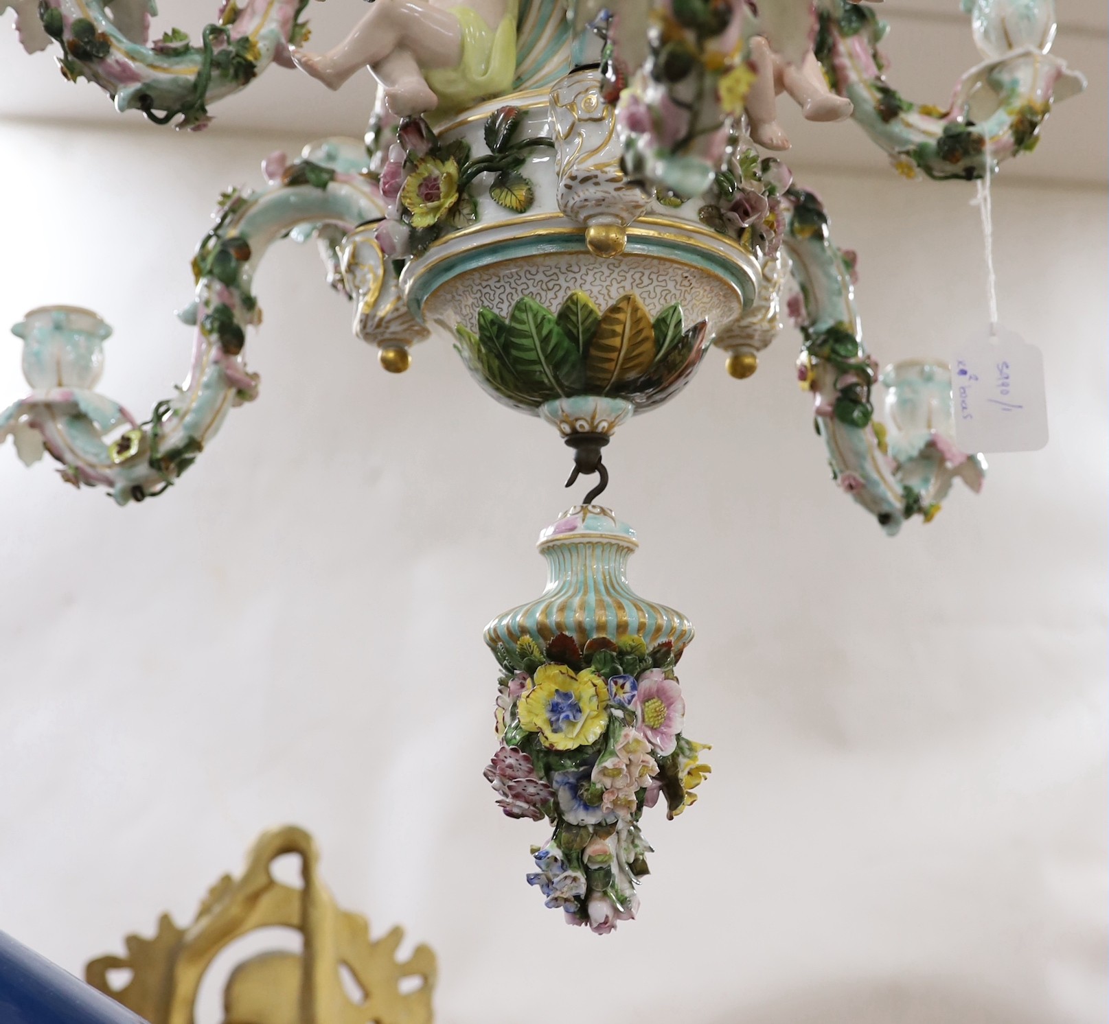 A 19th century continental floral encrusted porcelain nine branch chandelier, 77cm drop